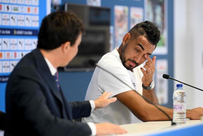 Dimitri Payet reacts next to the Spanish president of Olympique de Marseille, Pablo Longoria, during a press conference at the Stade-Vélodrome, in Marseille, southern France, July 21, 2023.