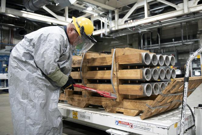 This photo released by the U.S. military shows an operator cutting the metal strips from a pallet of M55 rockets containing sarin, July 6, 2022, at the Blue Grass depot near Richmond, Kentucky.