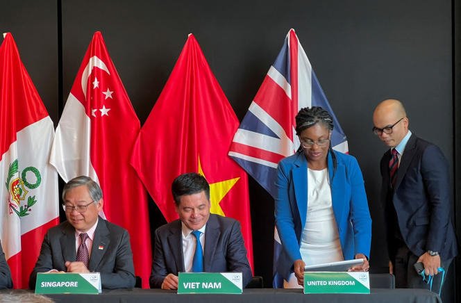 Singapore's Trade and Industry Minister Gan Kim Yong, Vietnam's Trade and Industry Minister Nguyen Hong Dien and British Secretary of State for Business and Trade Kemi Badenoch on the day where Britain signs the Treaty of Accession to the Comprehensive and Progressive Agreement for the Trans-Pacific Partnership, in Auckland, New Zealand on July 16, 2023.