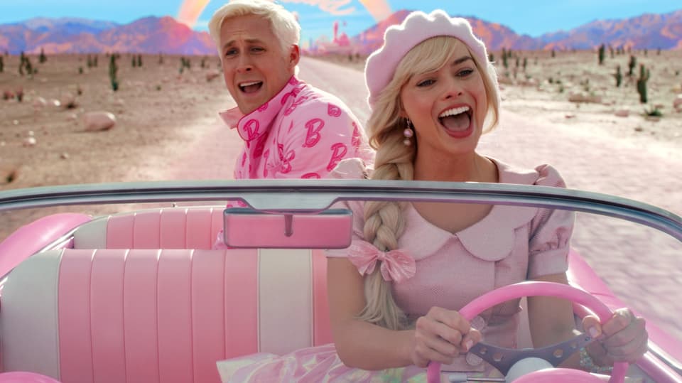 Barbie and Ken drive a car.