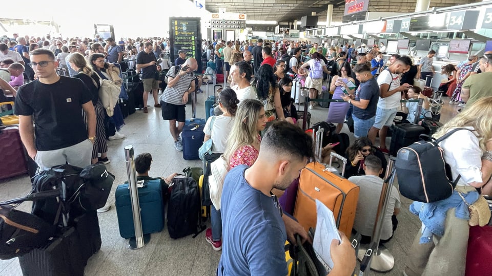 People are waiting at Catania airport.