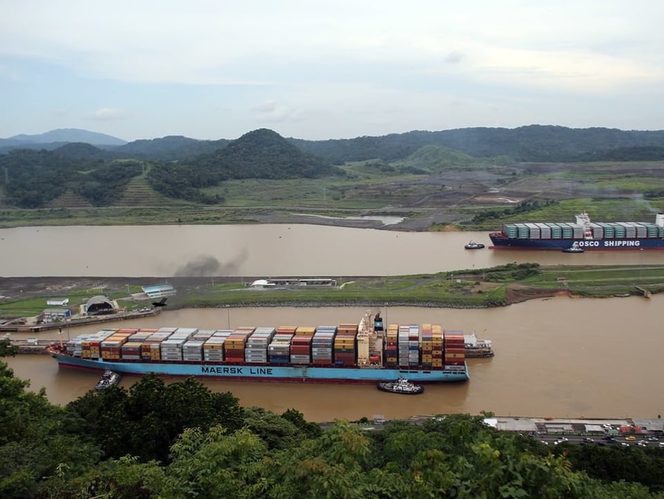 Two freighters sail on the Panama Canal. 