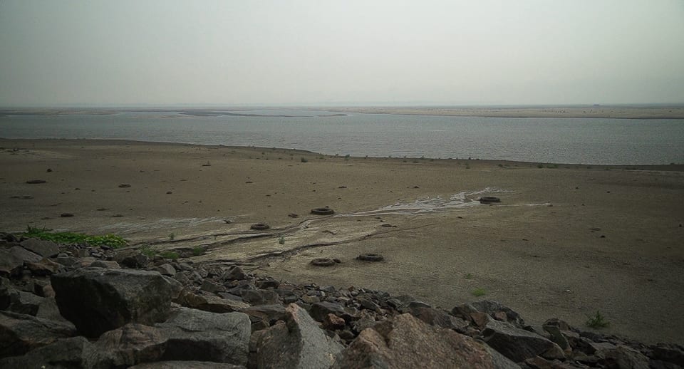 View of the Dnipro River with a partially dried up river bed