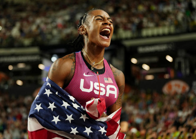 American Sha'Carri Richardson celebrates her gold medal in the 100m on August 21, 2023, during the World Championships in Budapest.