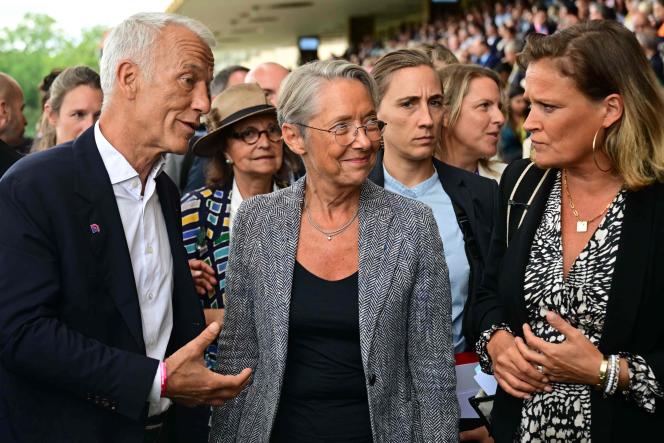 Medef President Patrick Martin talks with French Prime Minister Elisabeth Borne and Minister Delegate for Small and Medium Enterprises Olivia Grégoire during a meeting of French entrepreneurs (REF) organized by Medef at the Longchamp racecourse in Paris, August 28, 2023.