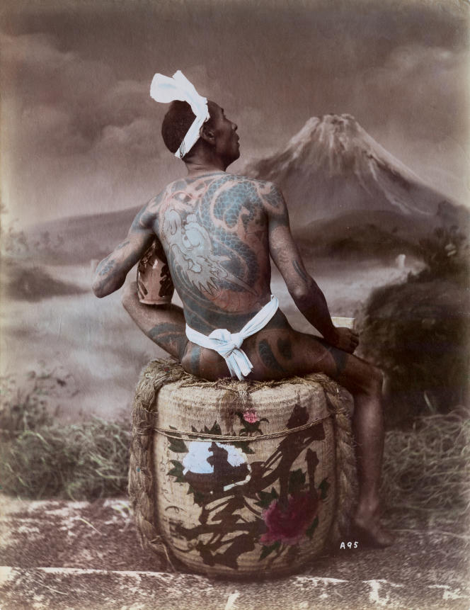 Photograph by Adolfo Farsari (1841-1898), representing a tattooed man, in Japan, during the Meiji era (1868-1912).