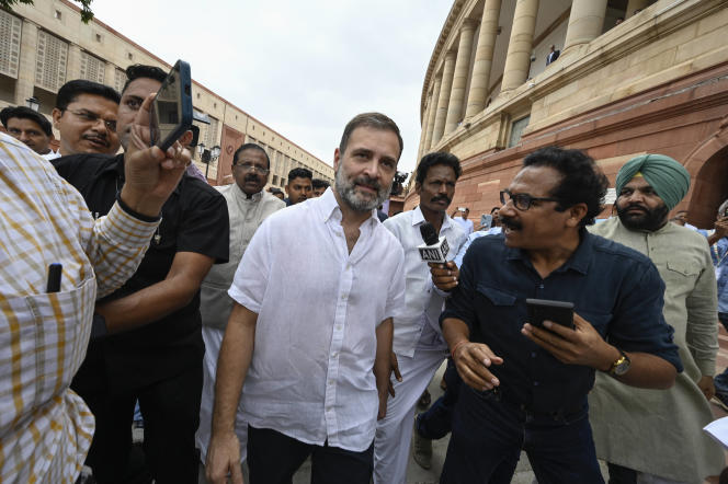 India's opposition leader Rahul Gandhi, center, arrives at parliament in New Delhi on August 7, 2023. 