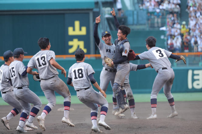 The Keio High School team from Yokohama (southern Tokyo) celebrates their victory in the Japanese High School Baseball Championship final against Sendai Ikuei Gakuen at Koshien Stadium in Nishinomiya City, Japan, Aug. 23, 2023.