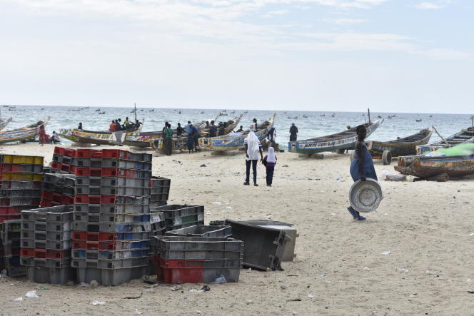 Pirogues and fishermen on Fass Boye beach, located 150 km from Dakar, Senegal, August 25, 2023.