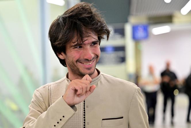 Franco-Spanish lawyer Juan Branco upon his arrival at Roissy-Charles-de-Gaulle airport, in the Paris region, on August 8, 2023.
