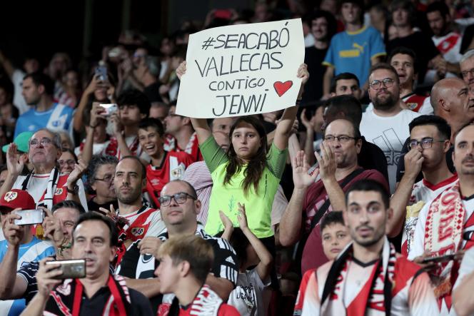 A young girl holds a sign reading 'With you Jenni' before the Spanish La Liga soccer match between Madrid's Rayo Vallecano and Club Atletico de Madrid at Vallecas stadium in Madrid on August 28, 2023.