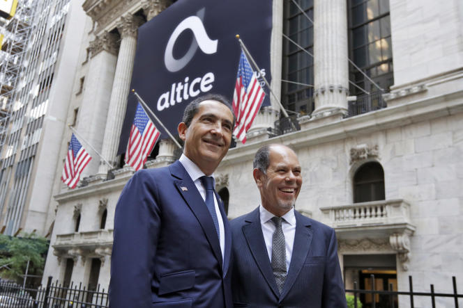 Altice co-founders Patrick Drahi (left) and Armando Pereira at the telecommunications group's IPO on the New York Stock Exchange on June 22, 2017.
