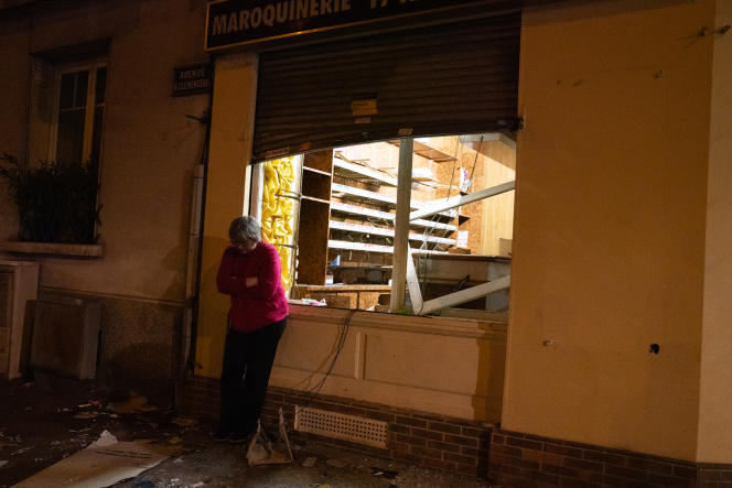 The owner of a looted and ransacked tobacconist in front of her business, rue Georges-Clemenceau, in Nanterre, June 29, 2023.