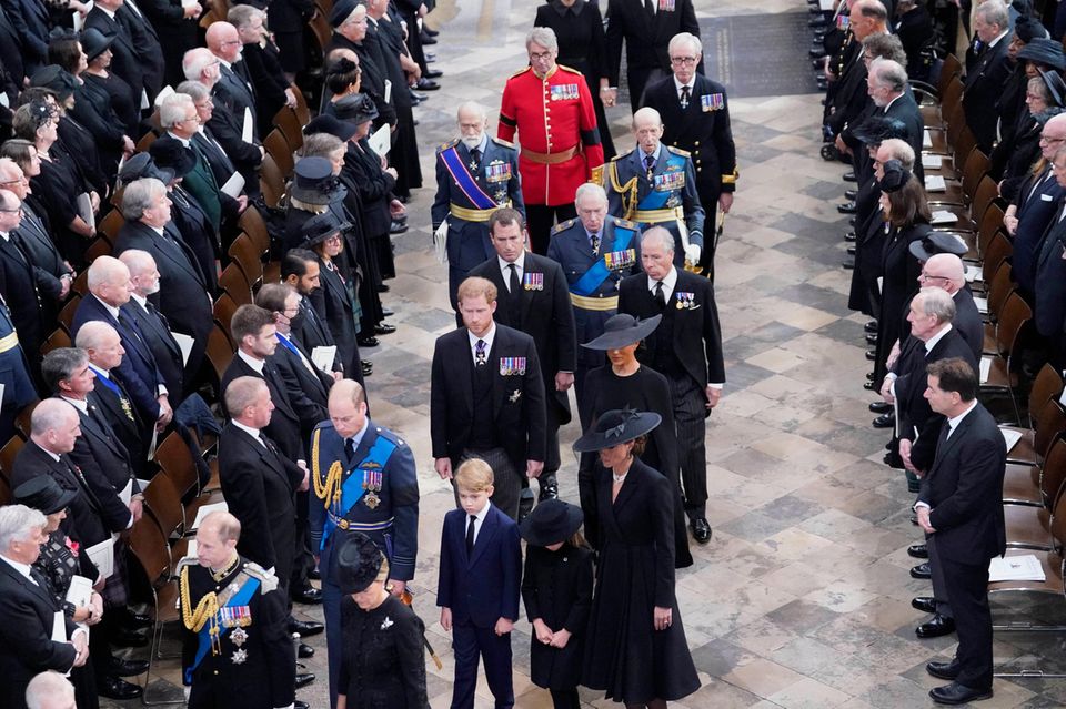 The Royal Family walk into the church behind the coffin at Queen Elizabeth's state funeral.