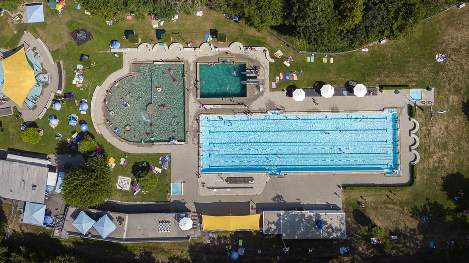 The pool has three large pools and lots of green space.