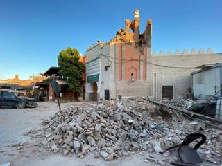 A mosque in Marrakech was destroyed in the earthquake, and pieces of rubble are lying around.