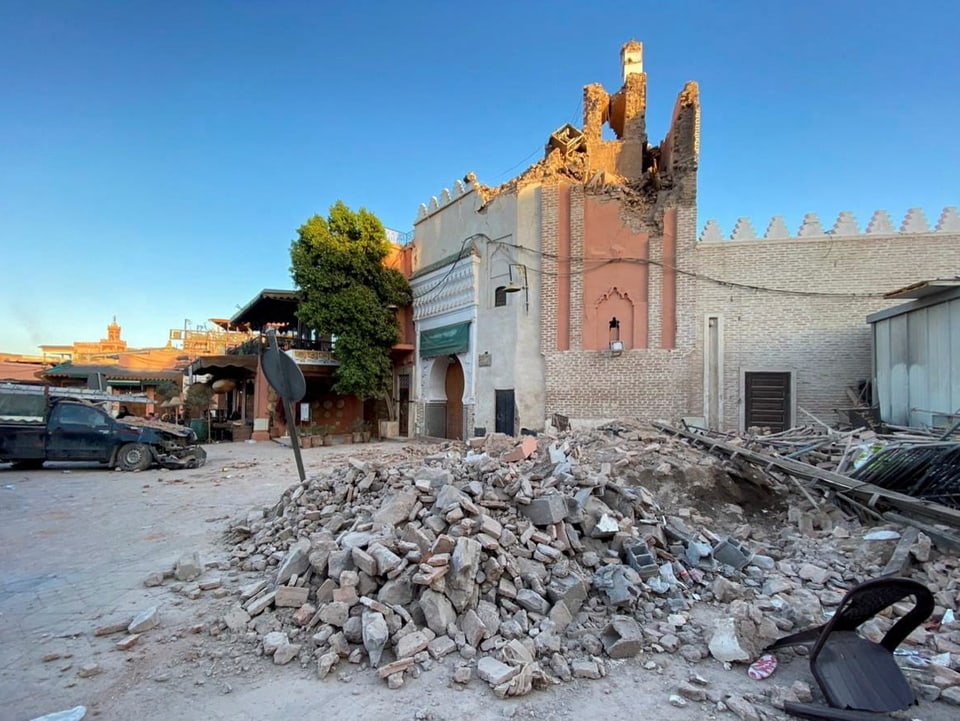 A mosque in Marrakech was destroyed in the earthquake, and pieces of rubble are lying around.