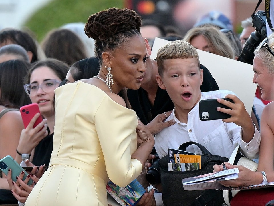 Boy takes selfie with actress.