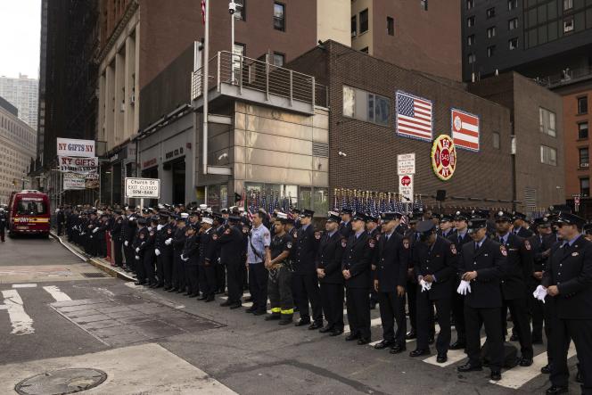 Firefighters observe a minute of silence during the commemoration ceremony for the twenty-second anniversary of the terrorist attacks of September 11, 2001, Monday, September 11, 2023, in New York.