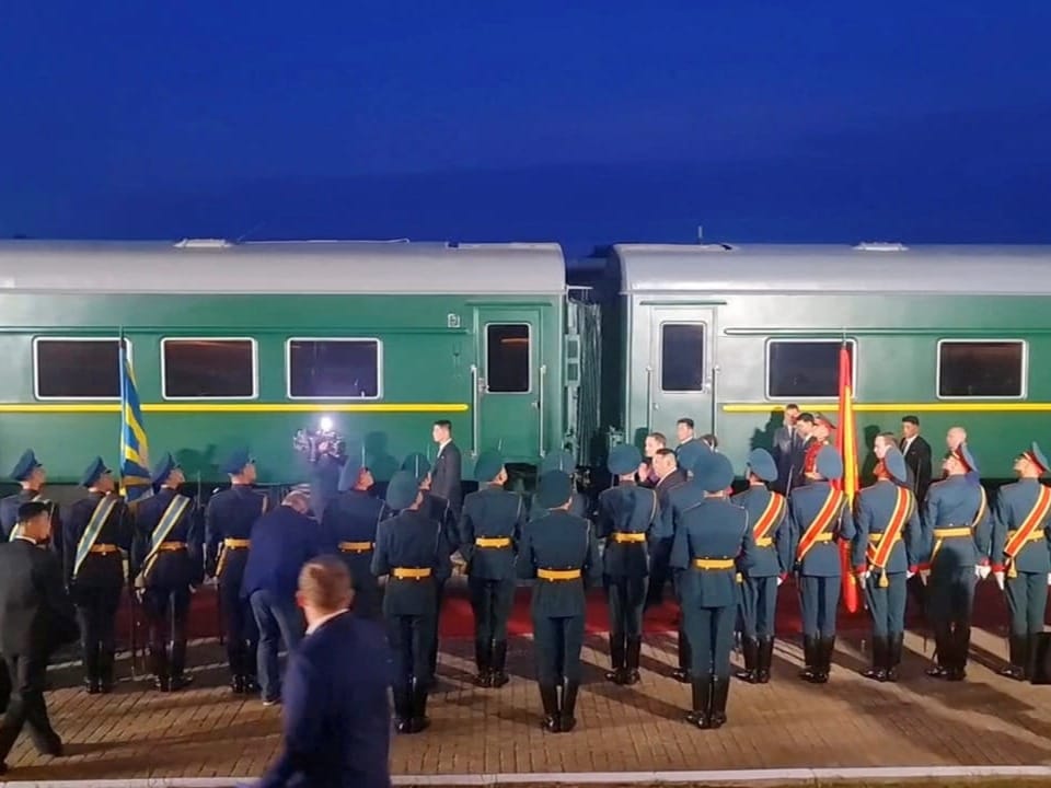 Soldiers in front of a train