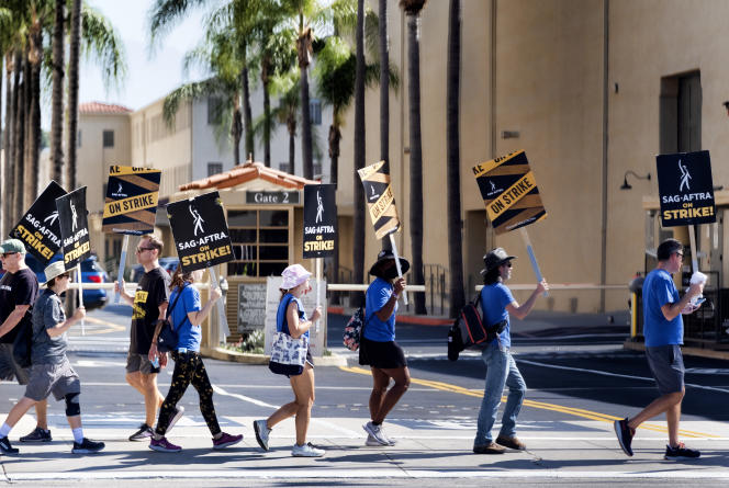 As a sign of solidarity, screenwriters join the actors' union picket lines in front of Warner Bros. studios on September 26, 2023.