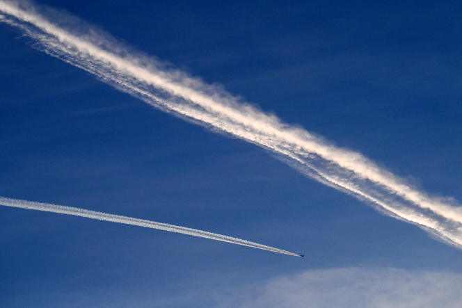 A plane leaves a contrail above Islamabad, Pakistan, February 23, 2023.