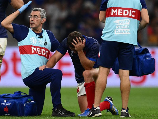 French scrum-half and captain Antoine Dupont receives medical treatment during the World Cup match against Namibia at the Stade de Vélodrome in Marseille, September 21, 2023.