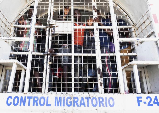 Haitians due to be deported, in a police truck on a border bridge between the Dominican Republic and Haiti, September 14, 2023.