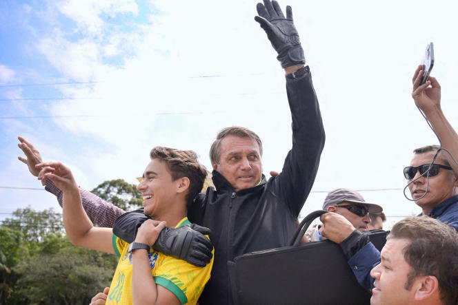 MP Nikolas Ferreira, 27, in the arms of his mentor, Jair Bolsonaro, September 30, 2022.