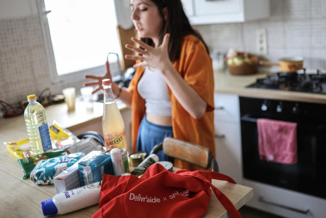 A student in front of a bag of food and hygiene products that she received from the Delivr'aide association, in Toulouse, May 10, 2023.