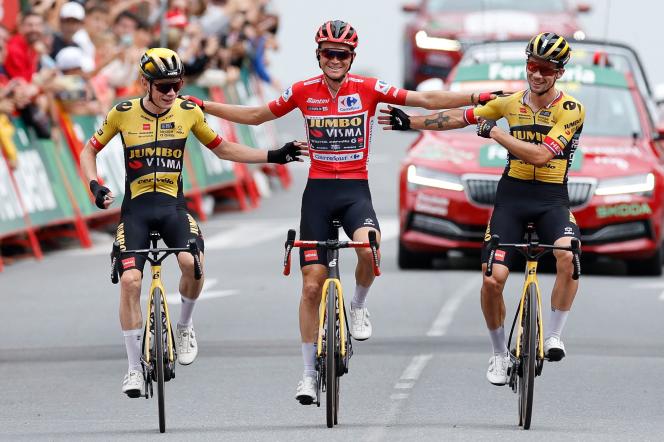Jonas Vingegaard and Primoz Roglic congratulate Vuelta winner Sepp Kuss during the 20th stage to Guadarrama, September 16, 2023.