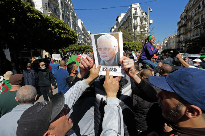 A portrait of former Algerian Defense Minister Khaled Nezzar held up during a demonstration in Algiers on March 12, 2021.