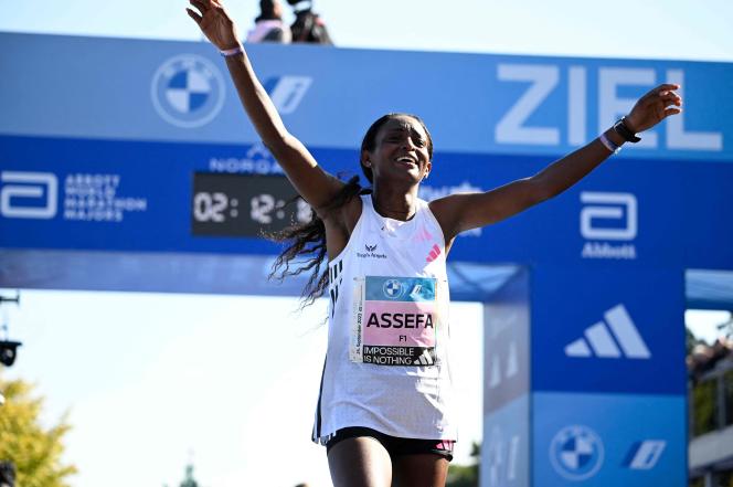 Ethiopian Tigist Assefa celebrates her victory at the finish line of the Berlin Marathon, September 24, 2023.