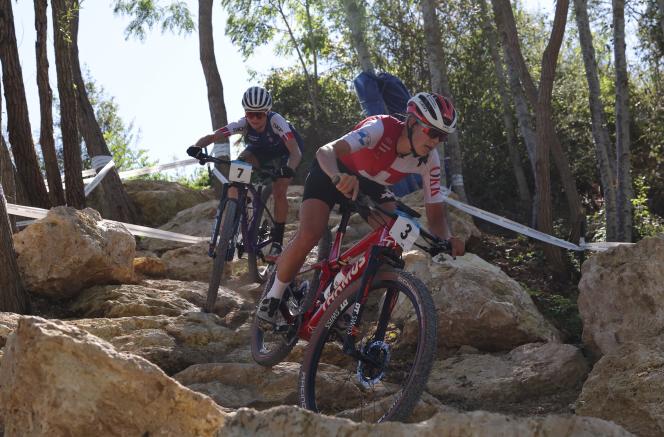 Swiss Alessandra Keller (right) and French Loana Lecomte (left) participate in the women's Elite Cross Country mountain bike test event, on Elancourt hill (Yvelines), September 24, 2023. 