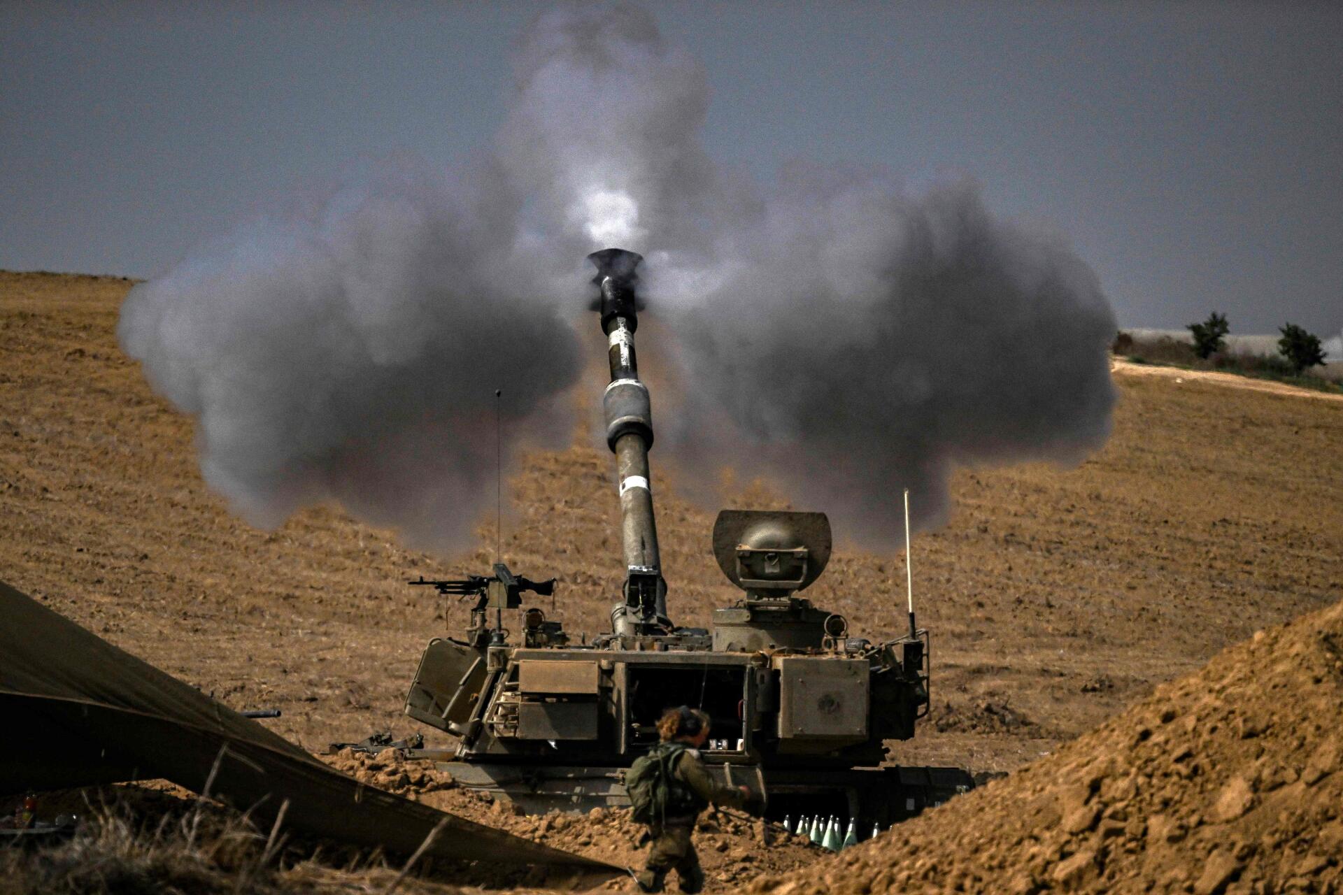 The Israeli army fires shells towards the Gaza Strip, October 28, 2023.