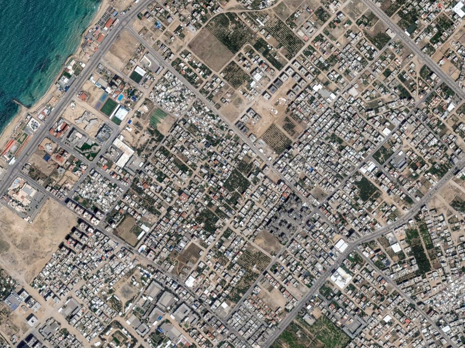 Satellite view of a city.  There is no destruction to be seen.