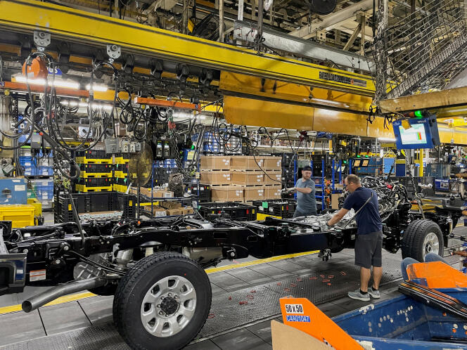 Employees work on the chassis of a Ford pickup truck at the Louisville, Kentucky, plant.  April 27, 2023.