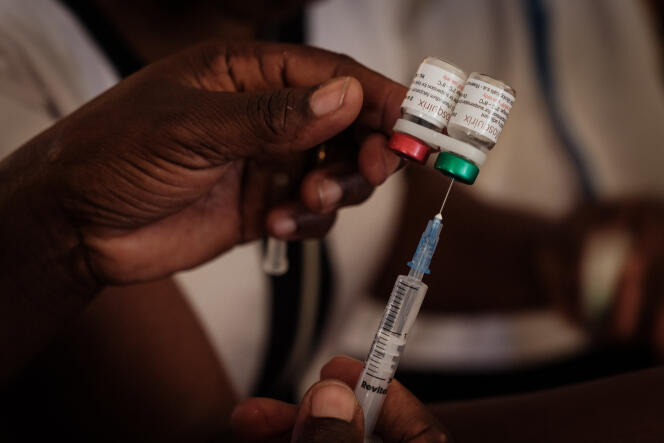 A nurse prepares a dose of malaria vaccine, in Gisambai, Kenya, March 7, 2023.
