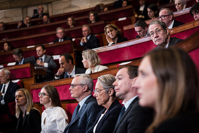 Elisabeth Borne, in the hemicycle of the Economic, Social and Environmental Council, surrounded by several ministers, in Paris, October 16, 2023.