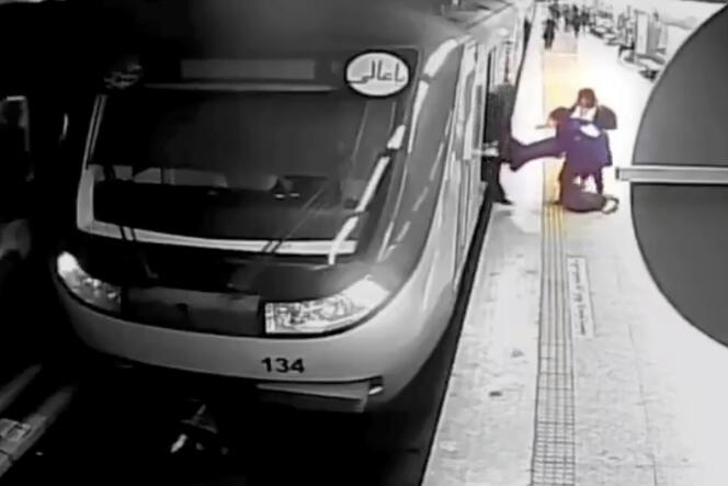 In this image taken from a surveillance video broadcast by Iranian state television, women pull Armita Geravand from a Tehran metro car, Sunday October 1, 2023.