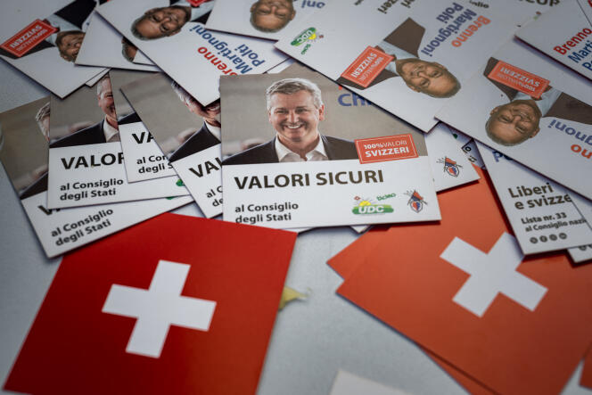 Election leaflets from UDC leader Marco Chiesa (center) on a party stand in Lugano (Switzerland), October 7, 2023.