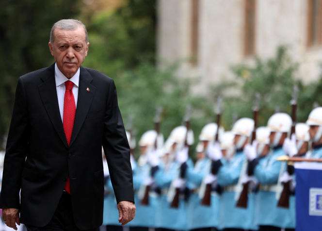 Recep Tayyip Erdogan walks in front of the Turkish army's honor guard, on the occasion of the re-opening of Parliament, in Ankara, Turkey, October 1, 2023.