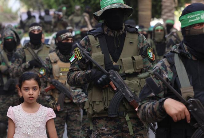 Members of the Ezzedine Al-Qassam Brigades, the armed wing of Hamas, march in Gaza City on May 22, 2021.