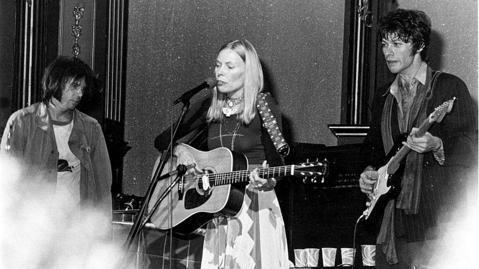 Joni Mitchell stars alongside Neil Young and Robbie Robertson in the mid-1990s.