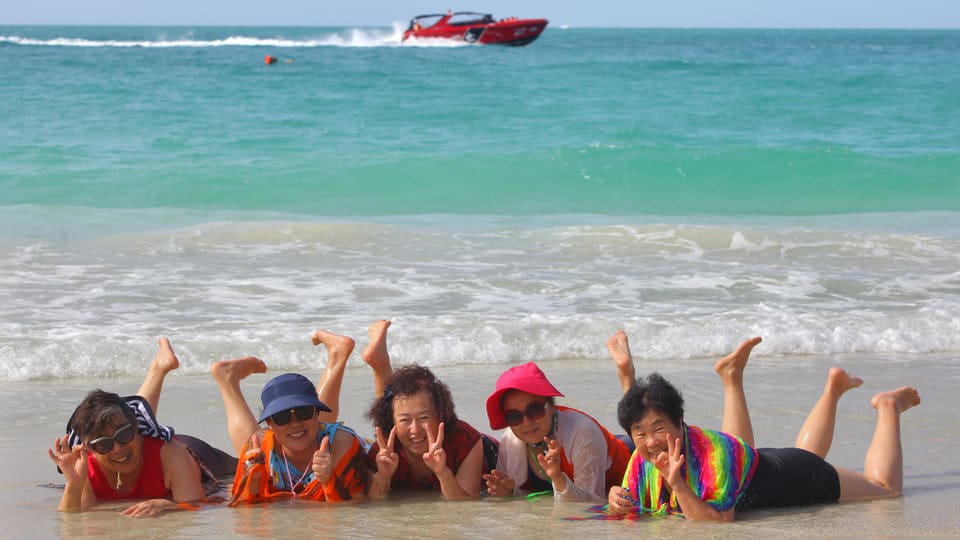 Chinese tourists on the beach of Ko Samet