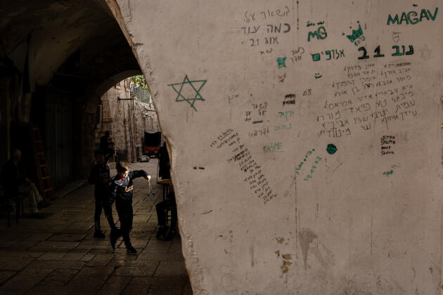 Dates, names and "sleep" are written on a wall in the Old City of Jerusalem, November 16, 2023. 