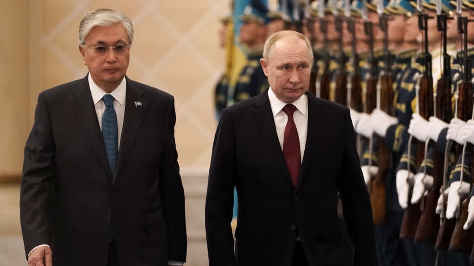Tokayev and Putin walk the guard of honor.