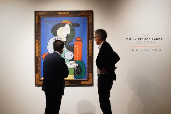Visitors in front of “Woman with a Watch”, by Picasso, before the sale of the Landau collection, at Sotheby’s in New York, September 13, 2023.