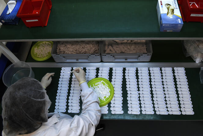 An employee of the French company NG Biotech prepares antibiotic resistance analysis tests, in Guipry-Messac (Ille-et-Vilaine), April 6, 2020.