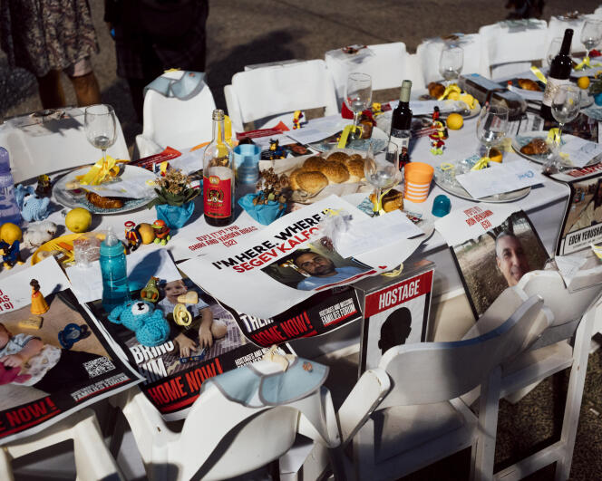 The table set up in front of the Tel Aviv Museum of Art to symbolize the absence of the 240 hostages still in the hands of Hamas in Gaza, November 6, 2023.